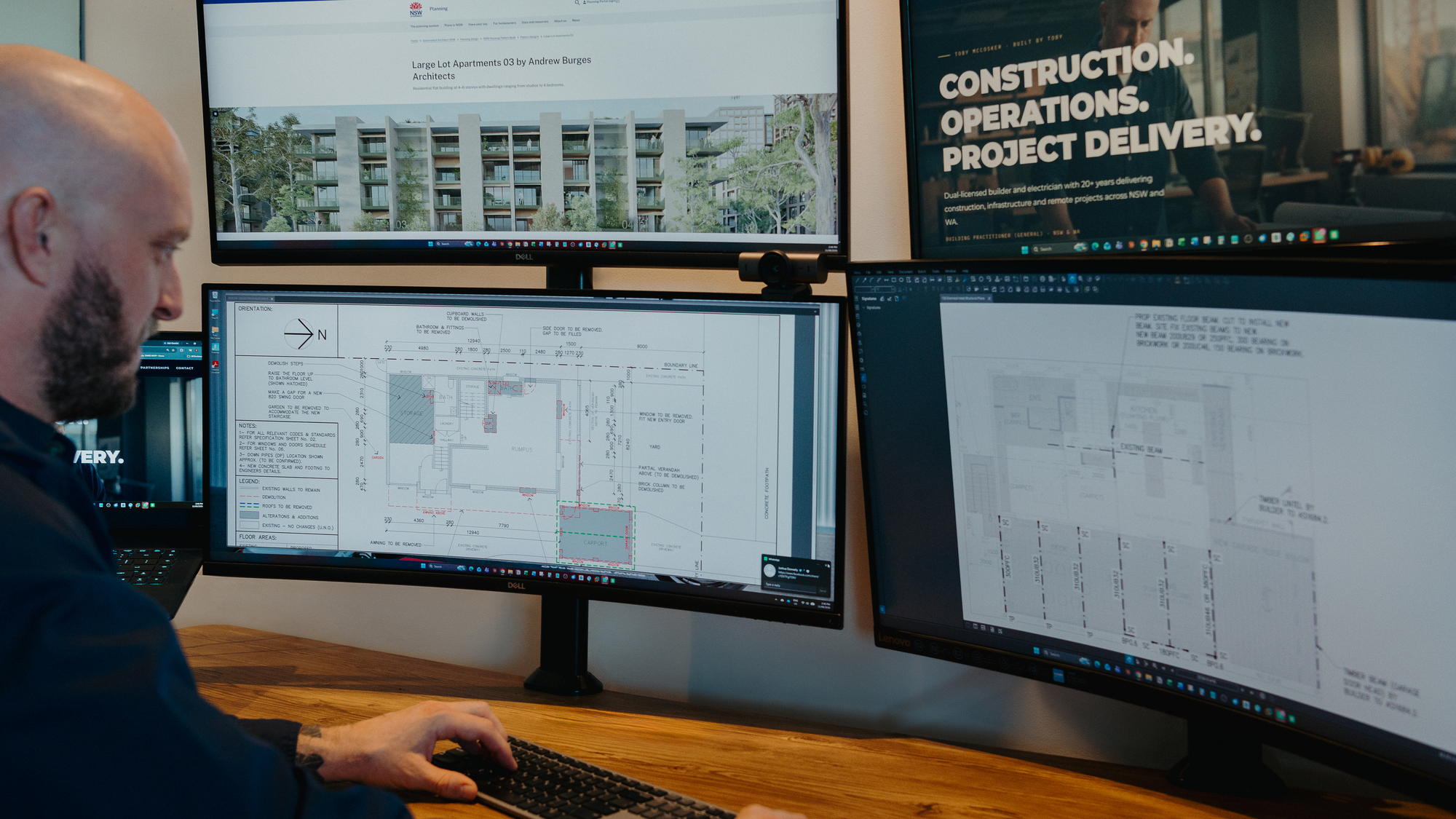 Project drawings and compliance documentation at an operations workstation