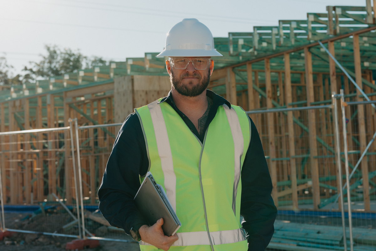 Toby McCosker supervising construction delivery on a building site