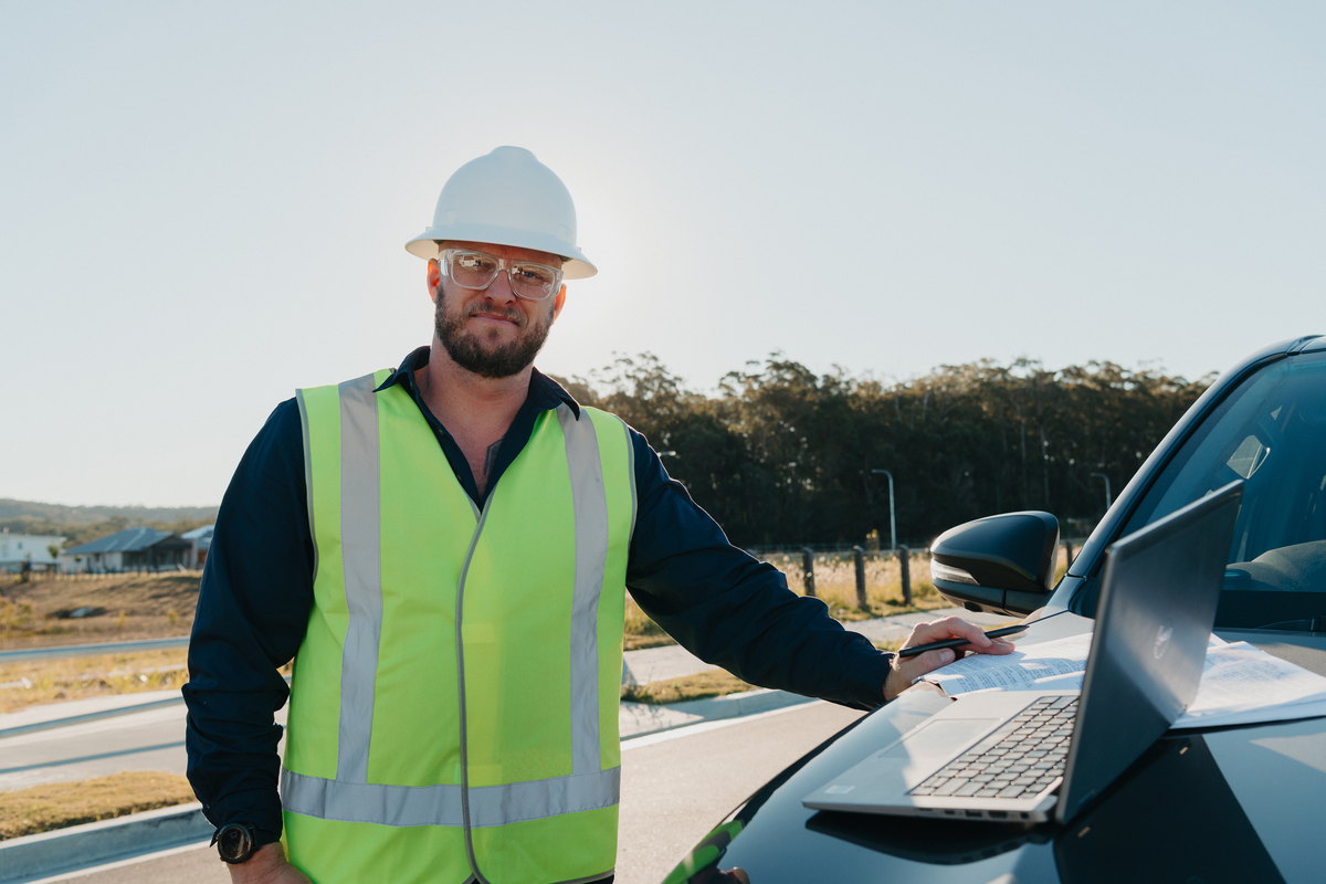 Toby McCosker reviewing project drawings on site, Mid North Coast NSW